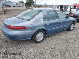 1999 Mercury Sable LS z VIN 1MEFM53S5XA647862, wystawiony jako IAAI lot #41762714 z przebiegiem 165 490 mil mil oraz . Historia ofert i sprzedaży dostępna na DreamBid. Obrazek 4.