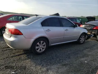 2009 Kia Optima LX z VIN KNAGE228195332931, wystawiony jako Copart lot #55279665 z przebiegiem 295 523 mil mil oraz Szkoda całkowita • Salvage title. Historia ofert i sprzedaży dostępna na DreamBid. Obrazek 3.