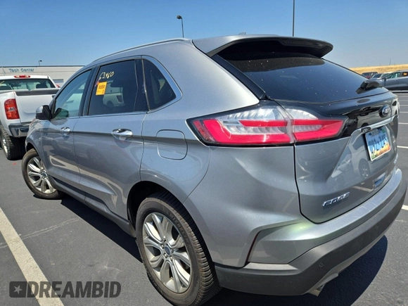 2020 Ford Edge Titanium with VIN 2FMPK4K92LBA30658, listed as a IAAI auction lot 42848998 with 63,460 mi miles and . Bid and sale history available at DreamBid. Image 2.