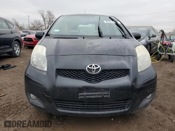 2011 Toyota Yaris with VIN JTDJT4K37B5339113, listed as a Copart auction lot 82474554 with 148,800 mi miles and Salvage Title. Bid and sale history available at carsss.com. Image 5.