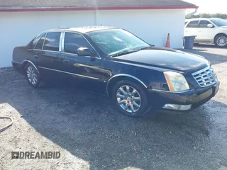 2008 Cadillac DTS 1SC with VIN 1G6KD57Y18U195569, listed as a IAAI auction lot 41936784 with 123,924 mi miles and . Bid and sale history available at carsss.com. Image 1.