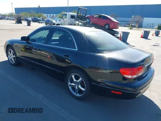 2002 Mazda Millenia S z VIN JM1TA222421728535, wystawiony jako IAAI lot #41525259 z przebiegiem 131 870 mil mil oraz . Historia ofert i sprzedaży dostępna na DreamBid. Obrazek 3.