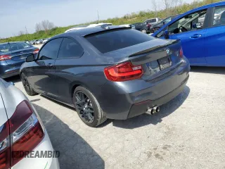 2015 BMW 2 Series 228i with VIN WBA1F5C57FV256779, listed as a Copart auction lot 49162474 with 69,078 mi miles and Salvage Title. Bid and sale history available at carsss.com. Image 2.