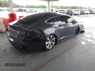 2021 Tesla Model S Long Range Plus with VIN 5YJSA1E28MF421655, listed as a IAAI auction lot 42407234 with 111,443 mi miles and . Bid and sale history available at DreamBid. Image 4.