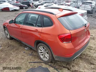 2015 BMW X1 xDrive28i with VIN WBAVL1C50FVY41206, listed as a IAAI auction lot 41508136 with 102,725 mi miles. Bid and sale history available at carsss.com. Image 3.