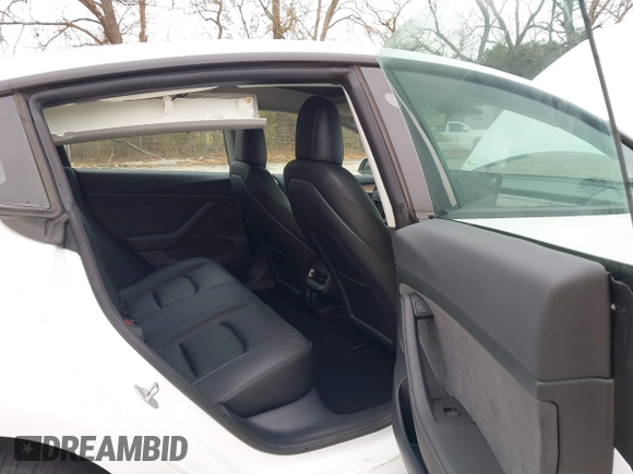 2023 Tesla Model 3 Long Range with VIN 5YJ3E1EB9PF393622, listed as a IAAI auction lot 41207132 with 14,097 mi miles and . Bid and sale history available at DreamBid. Image 8.