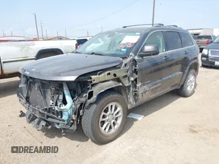 2020 Jeep Grand Cherokee Laredo E with VIN 1C4RJEAG2LC284912, listed as a IAAI auction lot 42114881 with 86,579 mi miles and . Bid and sale history available at DreamBid. Image 18.