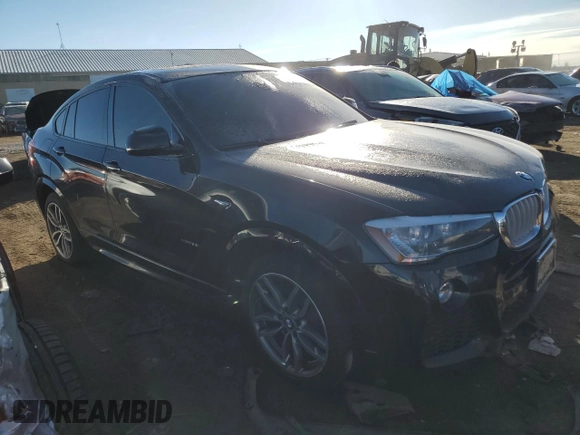 2015 BMW X4 xDrive35i with VIN 5UXXW5C56F0E87474, listed as a Copart auction lot 39752004 with 116,806 mi miles. Bid and sale history available at carsss.com. Image 4.