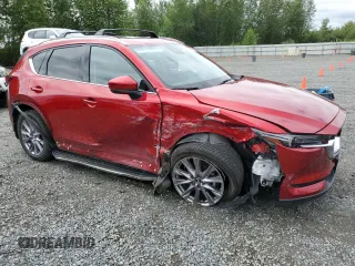 2019 Mazda CX-5 Grand Touring with VIN JM3KFBDM2K0639247, listed as a Copart auction lot 64060045 with 69,563 mi miles and Salvage title. Bid and sale history available at DreamBid. Image 4.