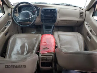 1999 Ford Explorer XLT with VIN 1FMDU34E7XZA60386, listed as a Copart auction lot 86851594 with 218,592 mi miles and Salvage title. Bid and sale history available at DreamBid. Image 8.