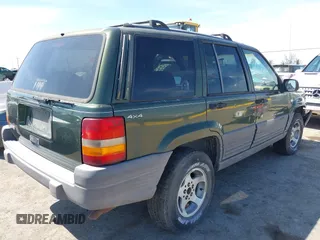 1996 Jeep Grand Cherokee Laredo with VIN 1J4GZ58S7TC280276, listed as a IAAI auction lot 42120454 with 230,617 mi miles. Bid and sale history available at carsss.com. Image 4.