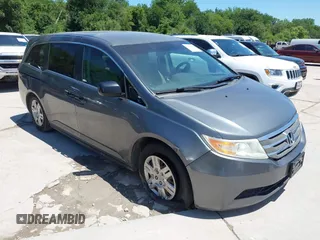 2011 Honda Odyssey LX z VIN 5FNRL5H24BB081767, wystawiony jako IAAI lot #42304139 z przebiegiem 182 486 mil mil oraz . Historia ofert i sprzedaży dostępna na DreamBid. Obrazek 1.