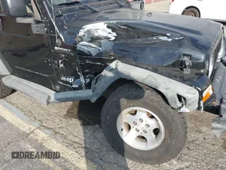 2003 Jeep Wrangler Sport with VIN 1J4FA49S23P328867, listed as a IAAI auction lot 41354414 with 96,703 mi miles. Bid and sale history available at carsss.com. Image 6.