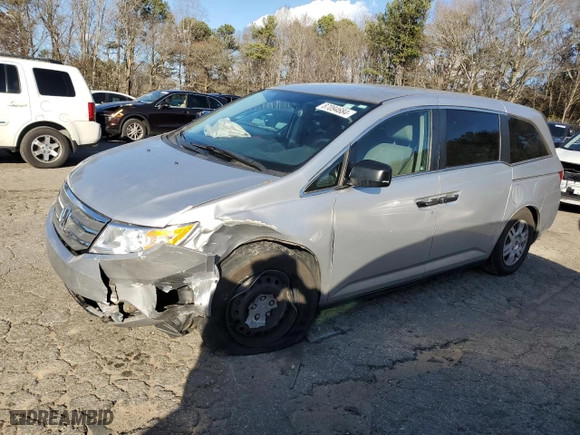 2012 Honda Odyssey LX with VIN 5FNRL5H26CB019627, listed as a Copart auction lot 87094684 with 214,563 mi miles and Salvage Title. Bid and sale history available at carsss.com. Image 1.