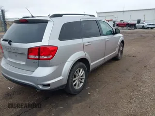 2013 Dodge Journey SXT with VIN 3C4PDCBG1DT647014, listed as a IAAI auction lot 42006636 with 192,911 mi miles. Bid and sale history available at carsss.com. Image 4.