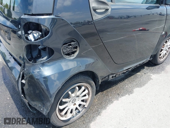 2012 Smart fortwo Pure z VIN WMEEJ3BA1CK556029, wystawiony jako IAAI lot #42173735 z przebiegiem 85 133 mil mil oraz . Historia ofert i sprzedaży dostępna na DreamBid. Obrazek 6.