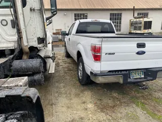 2014 Ford F-150 XL with VIN 1FTNF1CF7EKE17816, listed as a IAAI auction lot 41527762 with 196,338 mi miles. Bid and sale history available at carsss.com. Image 3.
