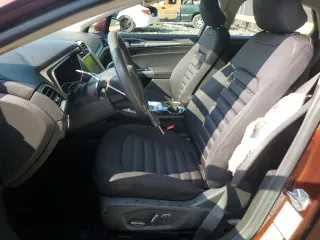 2016 Ford Fusion SE Hybrid z VIN 3FA6P0LU5GR377735, wystawiony jako Copart lot #58791955 z przebiegiem 135 798 mil mil oraz Szkoda całkowita • Salvage title. Historia ofert i sprzedaży dostępna na DreamBid. Obrazek 7.