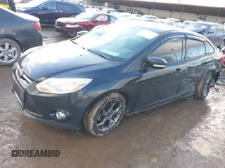 2013 Ford Focus SE z VIN 1FADP3F27DL342384, wystawiony jako IAAI lot #41474290 z przebiegiem 125 664 mil mil oraz . Historia ofert i sprzedaży dostępna na DreamBid. Obrazek 2.