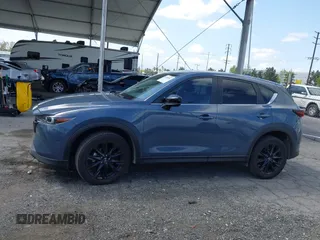 2023 Mazda CX-5 S Carbon Edition z VIN JM3KFBCM5P0179543, wystawiony jako IAAI lot #41950082 z przebiegiem 31 573 mil mil oraz . Historia ofert i sprzedaży dostępna na DreamBid. Obrazek 15.