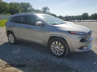 2017 Jeep Cherokee Overland with VIN 1C4PJMJS2HW584851, listed as a Copart auction lot 61738325 with 34,582 mi miles and Salvage title. Bid and sale history available at DreamBid. Image 4.