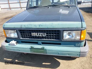 1990 Isuzu Trooper z VIN JACCH58EXL7903060, wystawiony jako IAAI lot #42516100 z przebiegiem 189 700 mil mil oraz . Historia ofert i sprzedaży dostępna na DreamBid. Obrazek 6.
