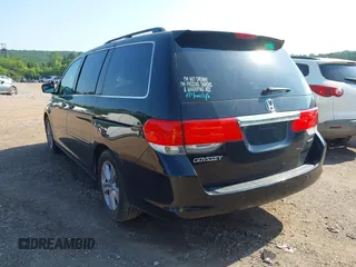 2010 Honda Odyssey Touring with VIN 5FNRL3H97AB104359, listed as a IAAI auction lot 42555872 with 233,952 mi miles and . Bid and sale history available at DreamBid. Image 3.