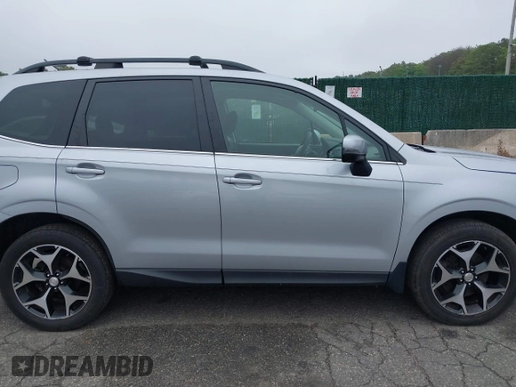 2014 Subaru Forester XT Touring with VIN JF2SJGMC1EH552474, listed as a IAAI auction lot 42461663 with 121,482 mi miles and . Bid and sale history available at DreamBid. Image 13.