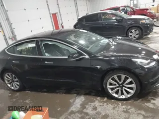 2018 Tesla Model 3 Long Range Battery with VIN 5YJ3E1EB7JF086778, listed as a IAAI auction lot 41348008 with 74,491 mi miles and . Bid and sale history available at DreamBid. Image 13.
