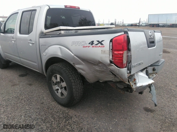 2011 Nissan Frontier PRO-4X with VIN 1N6AD0EV2BC438370, listed as a IAAI auction lot 41952484 with 217,529 mi miles. Bid and sale history available at carsss.com. Image 6.