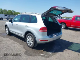 2014 Volkswagen Touareg Sport with VIN WVGEF9BP6ED007436, listed as a IAAI auction lot 41953307 with 114,925 mi miles and . Bid and sale history available at DreamBid. Image 3.