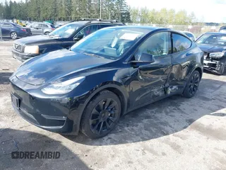 2022 Tesla Model Y Long Range with VIN 7SAYGDEEXNF459834, listed as a IAAI auction lot 42004576 with 56,175 mi miles and . Bid and sale history available at carsss.com. Image 2.