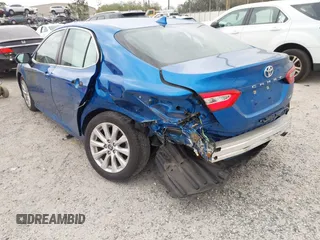 2020 Toyota Camry LE with VIN 4T1L11AK5LU310671, listed as a IAAI auction lot 41732306 with 61,379 mi miles and . Bid and sale history available at carsss.com. Image 6.