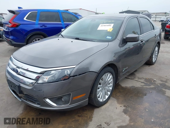 2012 Ford Fusion Hybrid z VIN 3FADP0L33CR289548, wystawiony jako IAAI lot #41905806 z przebiegiem 121 233 mil mil oraz . Historia ofert i sprzedaży dostępna na DreamBid. Obrazek 2.