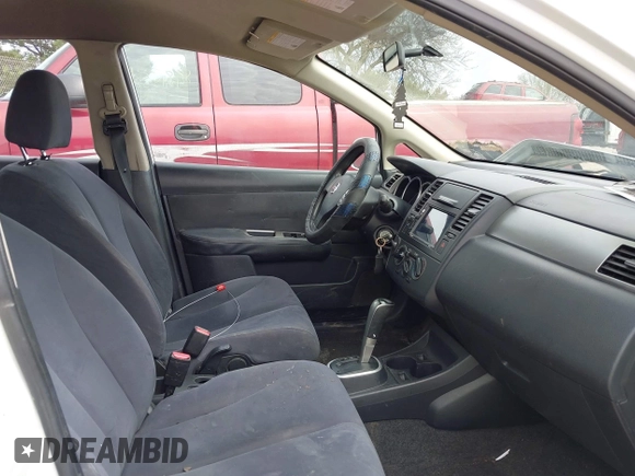 2009 Nissan Versa S with VIN 3N1BC13E39L450242, listed as a IAAI auction lot 42145528 with 239,291 mi miles and . Bid and sale history available at DreamBid. Image 5.