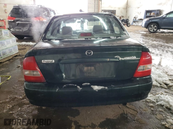 1999 Mazda Protege DX z VIN JM1BJ2220X0108600, wystawiony jako Copart lot #77004894 z przebiegiem 220 836 mil mil oraz Szkoda całkowita • Salvage title. Historia ofert i sprzedaży dostępna na DreamBid. Obrazek 6.