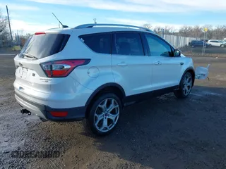 2017 Ford Escape Titanium with VIN 1FMCU9J98HUA04994, listed as a IAAI auction lot 41139988 with 136,989 mi miles. Bid and sale history available at carsss.com. Image 4.