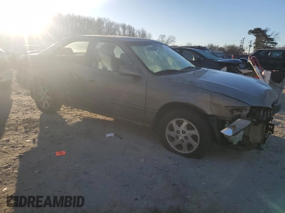 1999 Toyota Camry LE z VIN JT2BF22K0X0167589, wystawiony jako Copart lot #42699015 z przebiegiem 198 634 mil mil oraz Czysty tytuł • Clean title. Historia ofert i sprzedaży dostępna na DreamBid. Obrazek 4.
