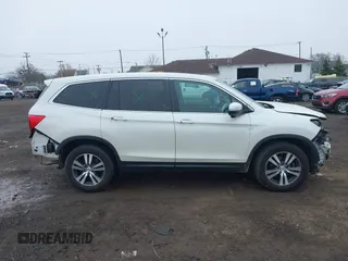 2018 Honda Pilot EX-L with VIN 5FNYF6H52JB053046, listed as a IAAI auction lot 42013210 with 103,721 mi miles. Bid and sale history available at carsss.com. Image 13.