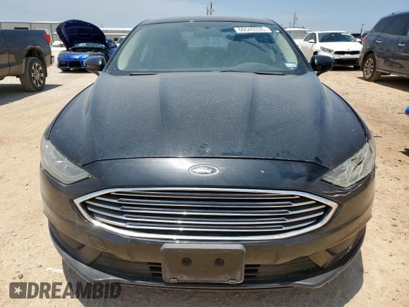 2018 Ford Fusion SE z VIN 3FA6P0HD5JR252718, wystawiony jako Copart lot #60549335 z przebiegiem 120 807 mil mil oraz Czysty tytuł • Clean title. Historia ofert i sprzedaży dostępna na DreamBid. Obrazek 5.