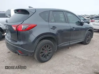 2016 Mazda CX-5 Sport with VIN JM3KE2BY4G0858100, listed as a IAAI auction lot 41368135 with 93,435 mi miles. Bid and sale history available at carsss.com. Image 4.