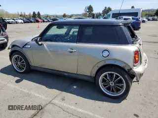2009 MINI Hardtop S with VIN WMWMF73549TT94143, listed as a Copart auction lot 52120615 with 144,334 mi miles and Salvage Title. Bid and sale history available at DreamBid. Image 2.