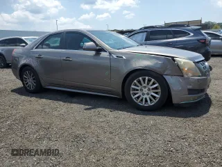 2012 Cadillac CTS Luxury with VIN 1G6DE5E54C0138040, listed as a Copart auction lot 61997305 with 140,996 mi miles and Salvage title. Bid and sale history available at DreamBid. Image 4.