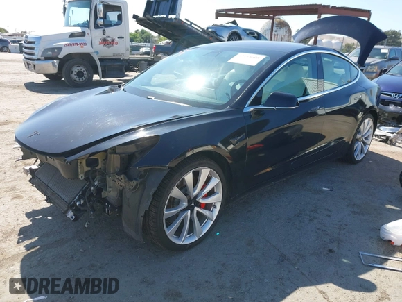 2019 Tesla Model 3 Long Range with VIN 5YJ3E1EB9KF231742, listed as a IAAI auction lot 42114608 with 86,657 mi miles and . Bid and sale history available at DreamBid. Image 2.