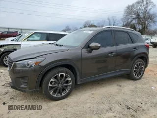 2016 Mazda CX-5 Grand Touring z VIN JM3KE4DYXG0897511, wystawiony jako Copart lot #46500235 z przebiegiem 113 591 mil mil oraz Szkoda całkowita • Salvage title. Historia ofert i sprzedaży dostępna na DreamBid. Obrazek 1.