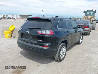 2019 Jeep Cherokee Latitude with VIN 1C4PJLCBXKD284954, listed as a IAAI auction lot 41877944 with 134,931 mi miles. Bid and sale history available at carsss.com. Image 4.
