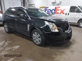 2014 Cadillac SRX Luxury Collection z VIN 3GYFNEE30ES585409, wystawiony jako IAAI lot #41744343 z przebiegiem 130 934 mil mil oraz . Historia ofert i sprzedaży dostępna na DreamBid. Obrazek 1.