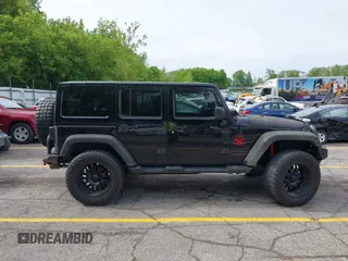 2014 Jeep Wrangler Unlimited Sahara с VIN 1C4BJWEG0EL248401, выставлен на аукционе IAAI как лот 42306970 с пробегом 134 904 миль миль и . История ставок и продаж доступна на DreamBid. Изображение 13.