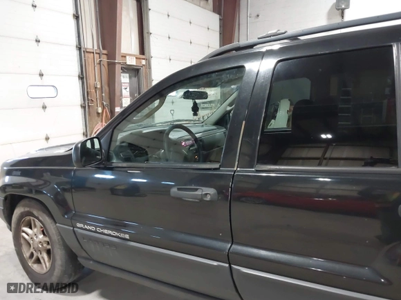 2003 Jeep Grand Cherokee Laredo with VIN 1J4GW48S63C552366, listed as a IAAI auction lot 41861501 with 227,464 mi miles. Bid and sale history available at carsss.com. Image 12.
