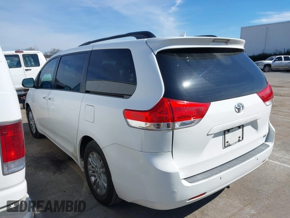 2011 Toyota Sienna XLE AAS with VIN 5TDYK3DCXBS043733, listed as a IAAI auction lot 41601544 with 221,658 mi miles and . Bid and sale history available at DreamBid. Image 14.
